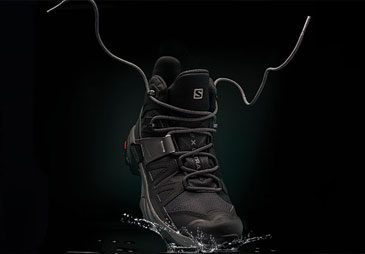 salomon x ultra 4 mid boot on a black background